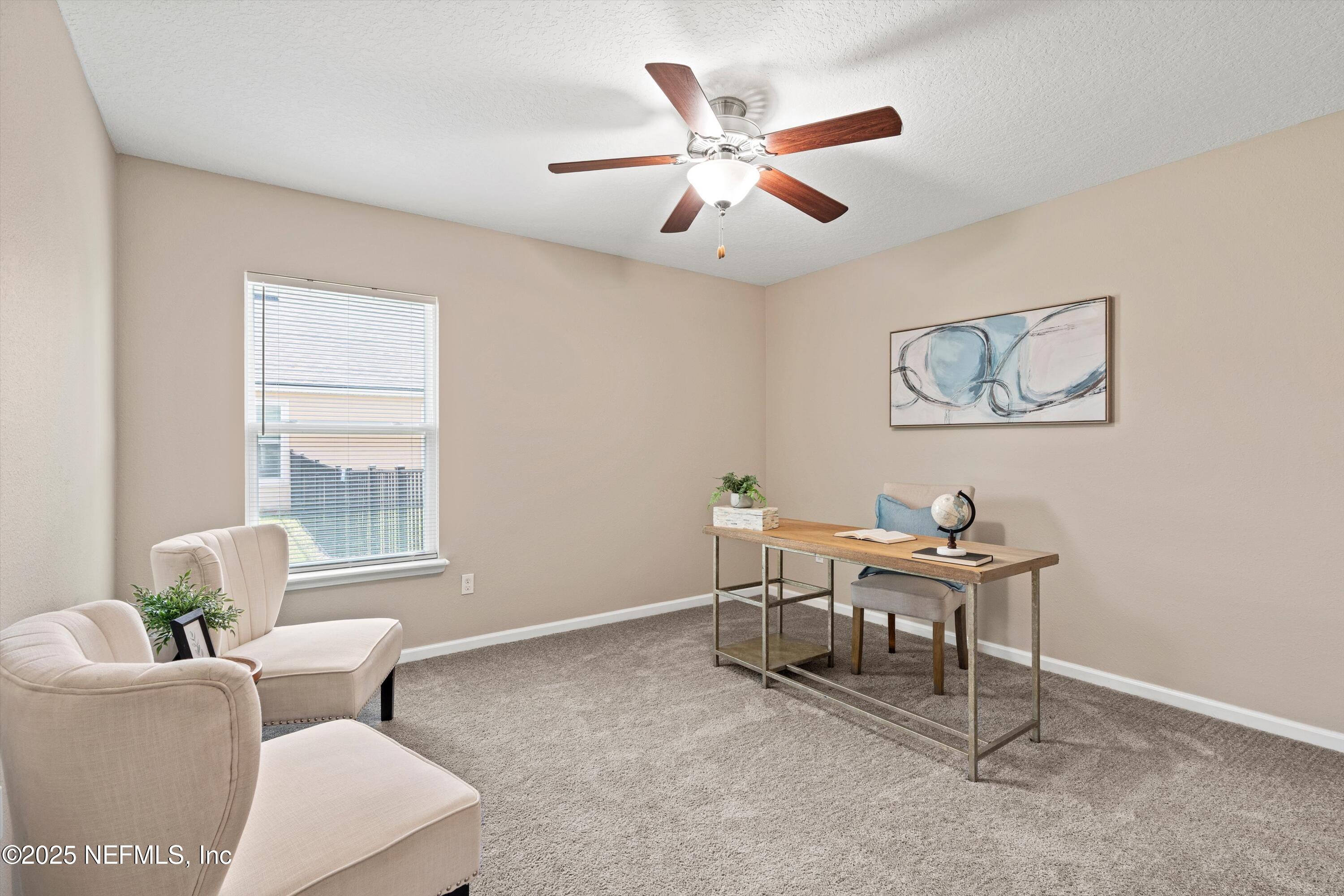 12264 Sacha Road Jacksonville, FL 32226 - Photo 17 of 32 a living room with furniture and a window