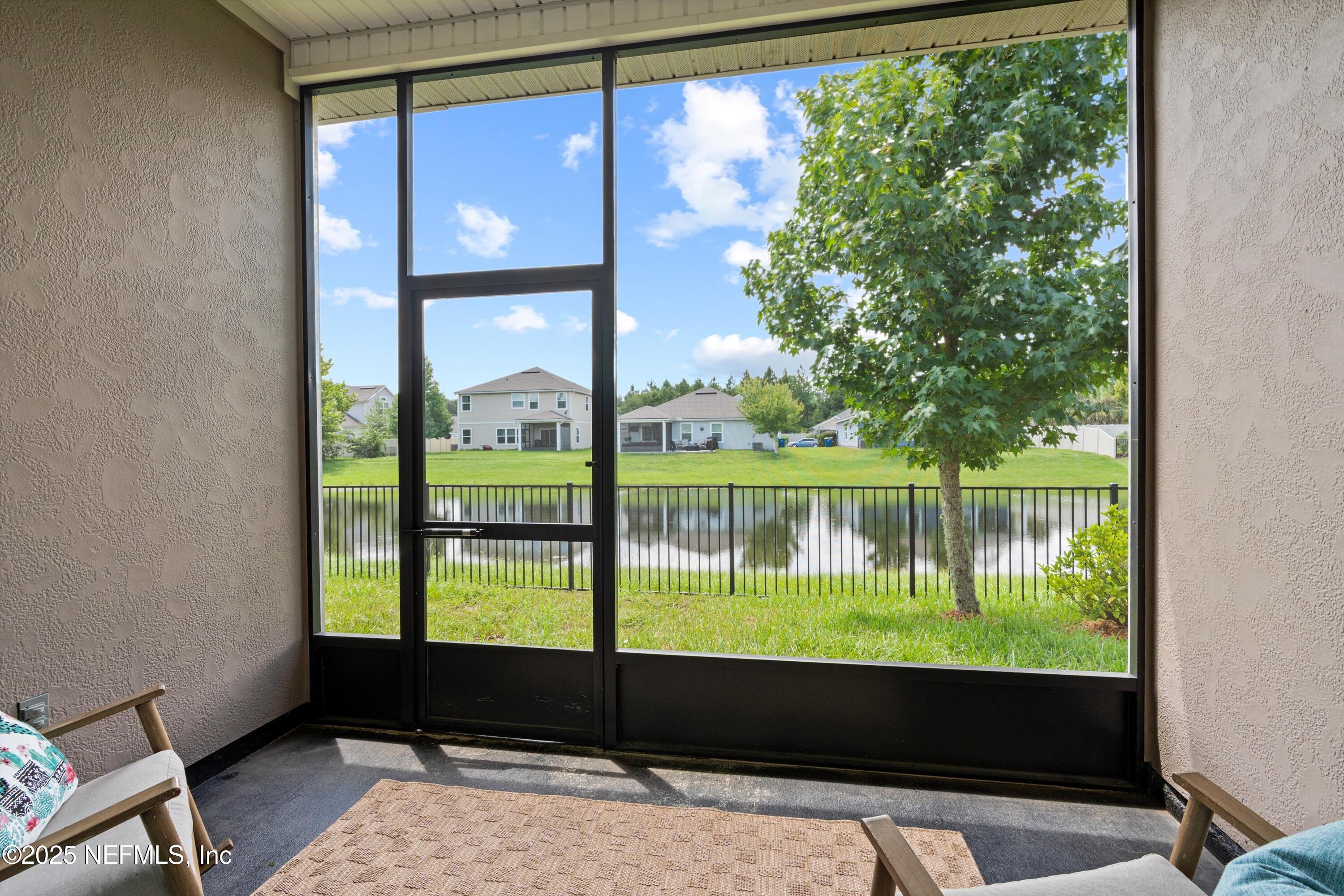 12264 Sacha Road Jacksonville, FL 32226 - Photo 24 of 32 a floor to ceiling window with a lake view
