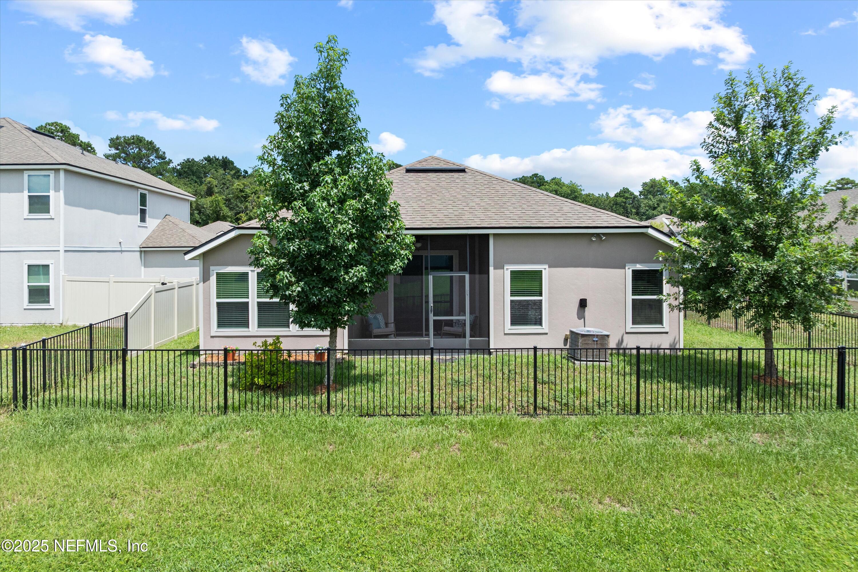 12264 Sacha Road Jacksonville, FL 32226 - Photo 26 of 32 a view of a house with a yard and sitting area
