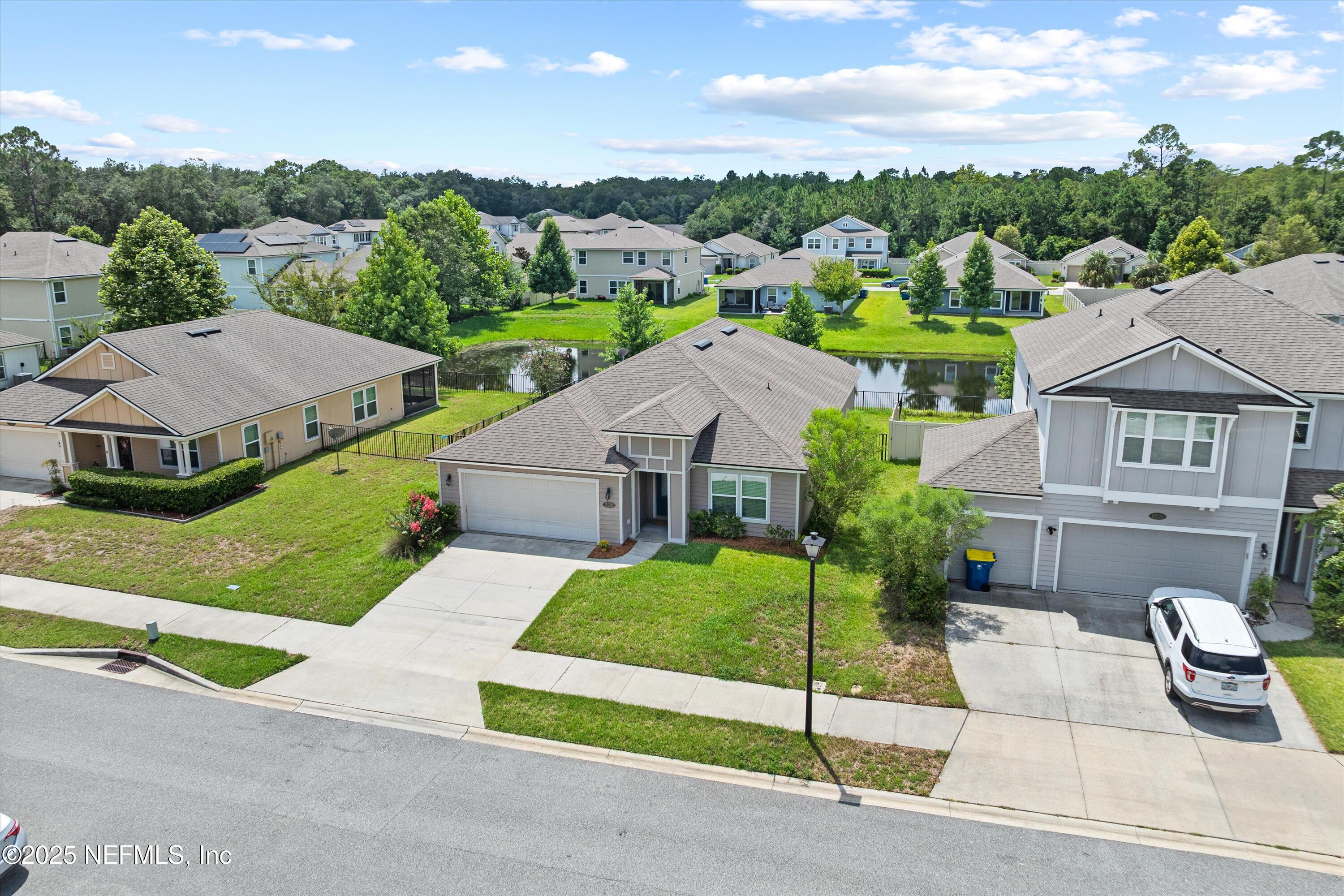 12264 Sacha Road Jacksonville, FL 32226 - Photo 27 of 32 a aerial view of a house with a garden and plants
