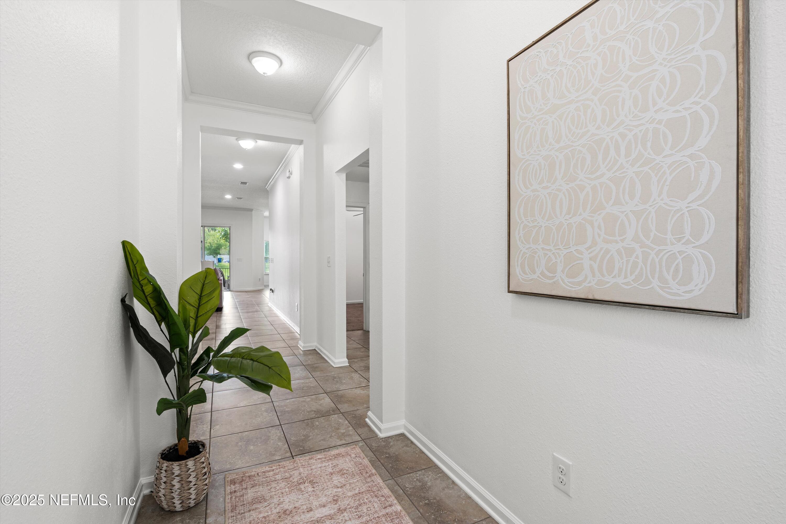 12264 Sacha Road Jacksonville, FL 32226 - Photo 3 of 32 a view of entryway with wooden floor