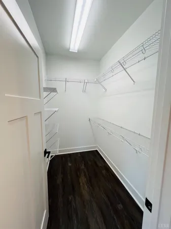 a view of storage and utility room with racks on the wall