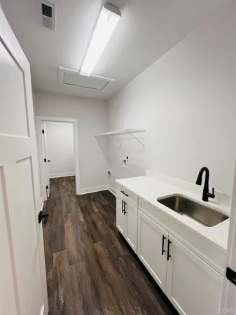 a kitchen with a sink and cabinets