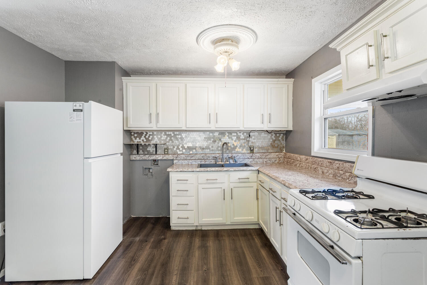 1468 Mather Drive Rantoul, IL 61866 - Photo 14 of 23 a kitchen with white cabinets and white appliances