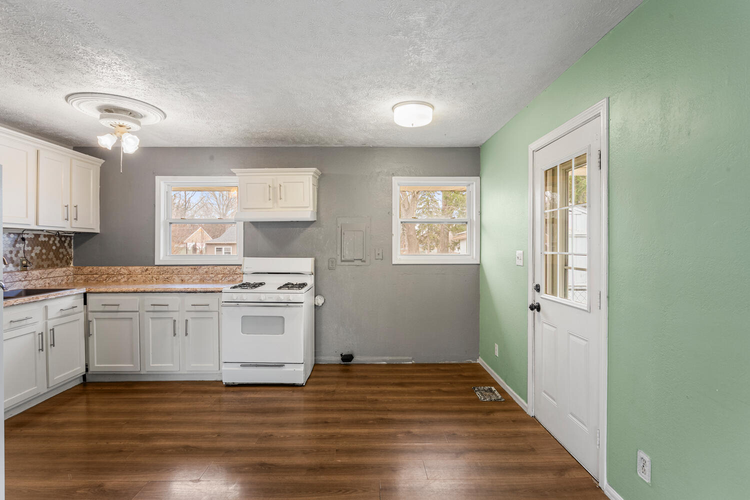 1468 Mather Drive Rantoul, IL 61866 - Photo 15 of 23 a kitchen with a stove and white cabinets