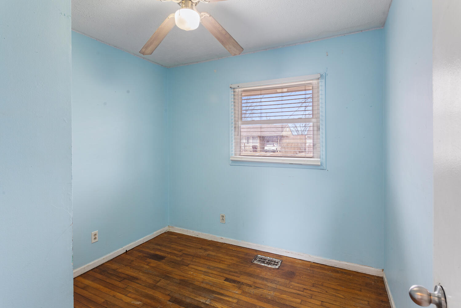 1468 Mather Drive Rantoul, IL 61866 - Photo 16 of 23 an empty room with wooden floor and windows