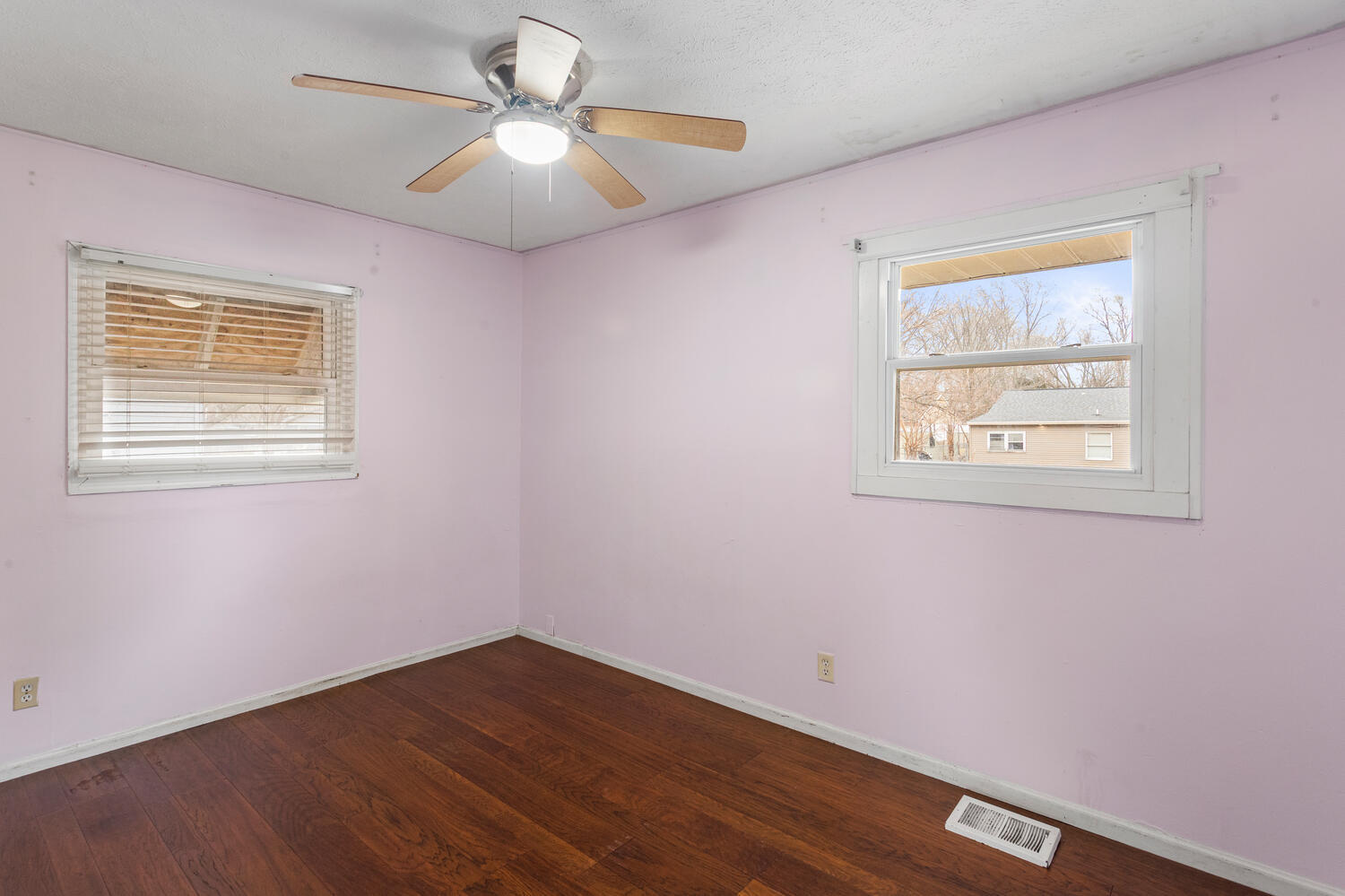1468 Mather Drive Rantoul, IL 61866 - Photo 20 of 23 a view of an empty room with a window and a ceiling fan