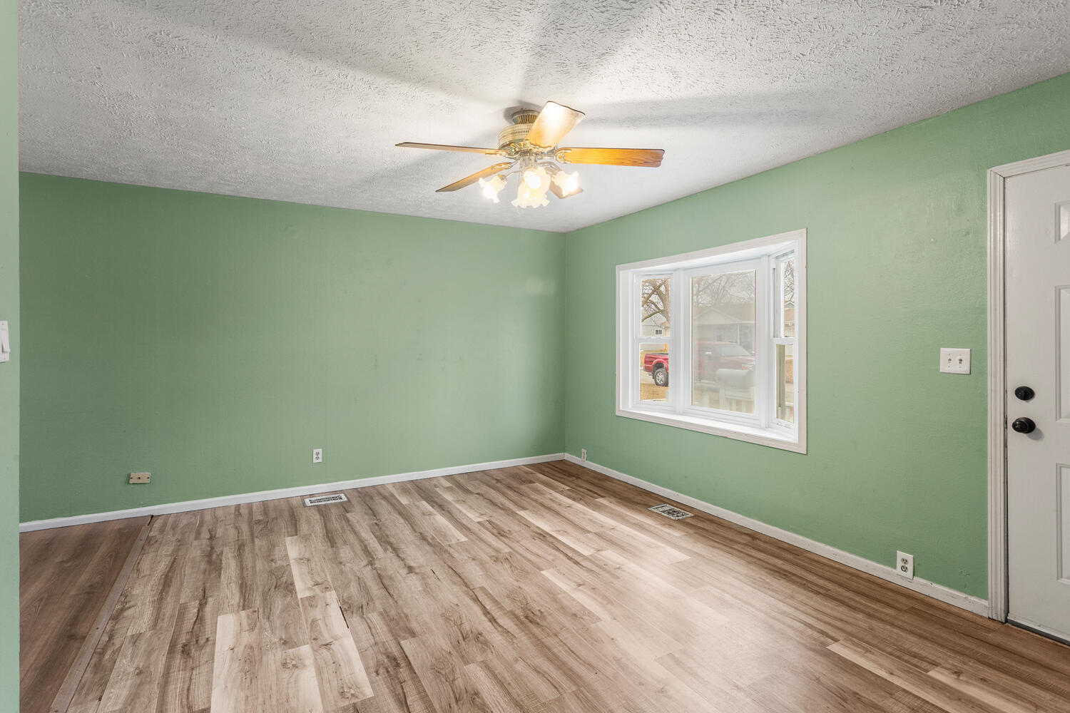1468 Mather Drive Rantoul, IL 61866 - Photo 9 of 23 a view of room with window and ceiling fan