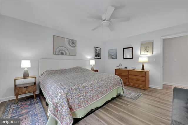 a bedroom with a bed and a night stand