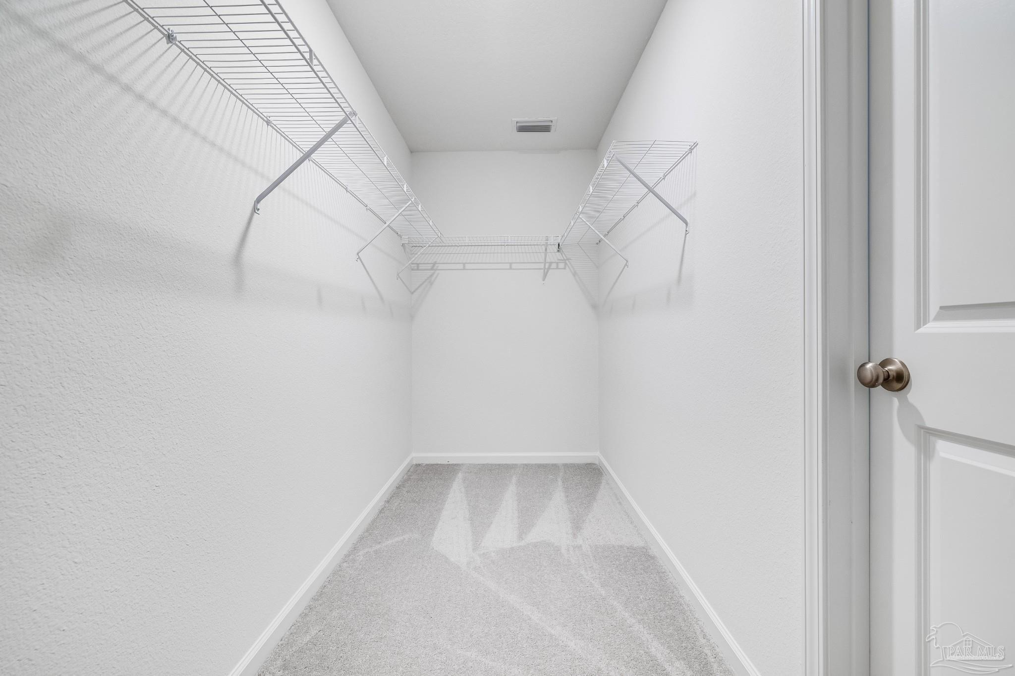 1115 Green Gate Road Cantonment, FL 32533 - Photo 25 of 47 a view of a room with racks on the wall