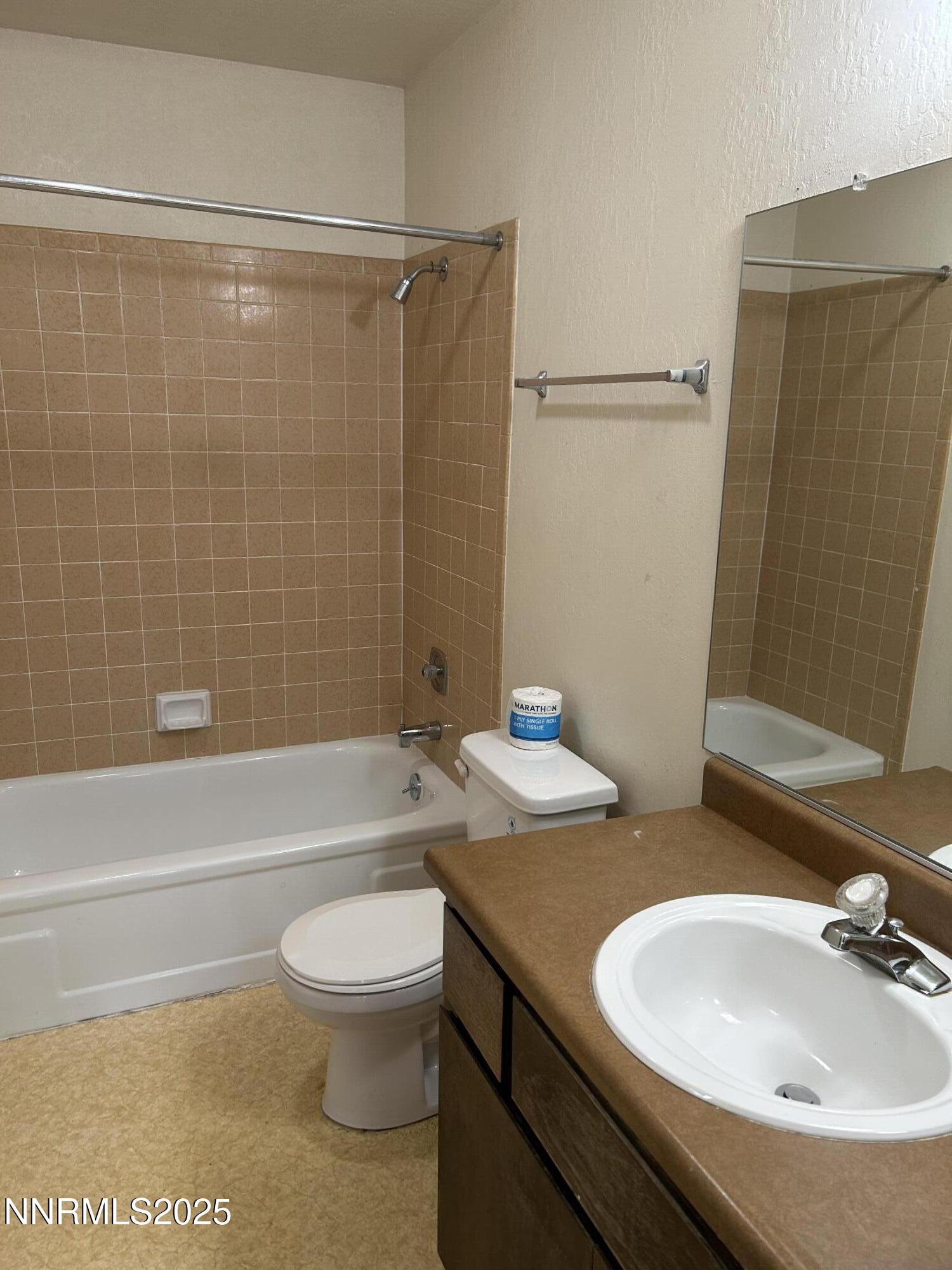 1000 Beck Drive, Unit 361 Reno, NV 89509 - Photo 17 of 32 a bathroom with a sink a toilet and a bathtub