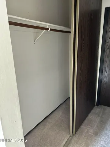 an empty room with wooden floor