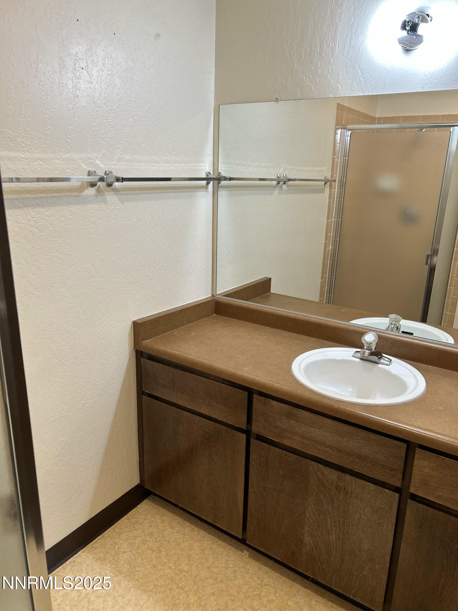 1000 Beck Drive, Unit 361 Reno, NV 89509 - Photo 25 of 32 a bathroom with a sink and a mirror