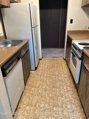 a view of a kitchen from a kitchen