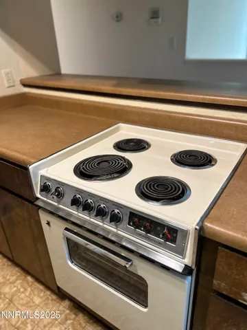 a close view of stove a microwave and a stove