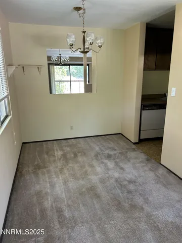 a view of a room that has a window in it