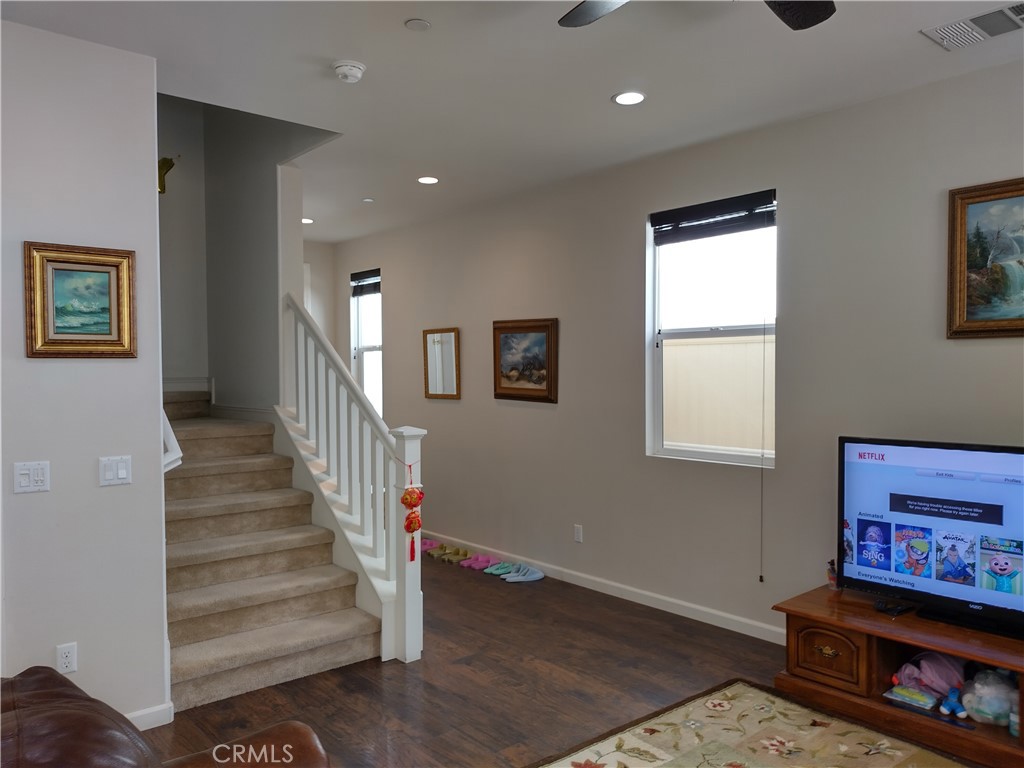 11811 Cramer Road Yucaipa, CA 92399 - Photo 13 of 56 a view of a hallway with wooden floor and windows