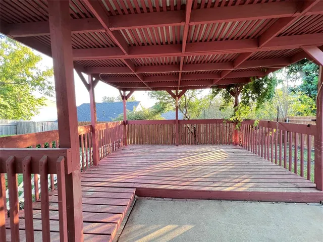 a wooden view of a backyard with wooden floor