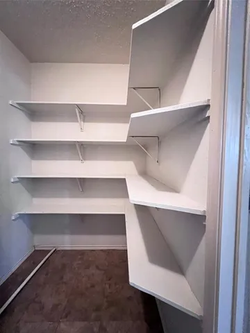 a view of an empty walk in closet