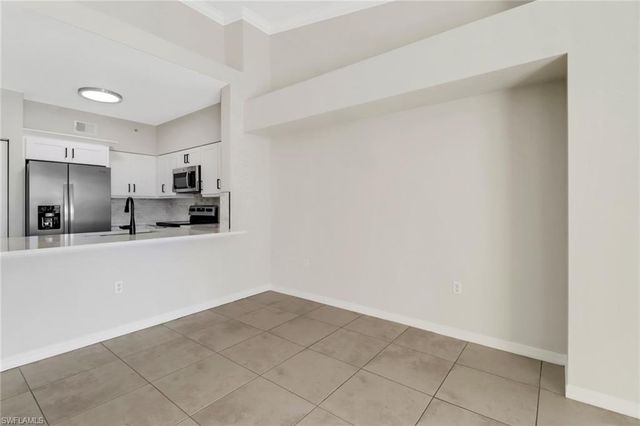 a view of a kitchen with a sink