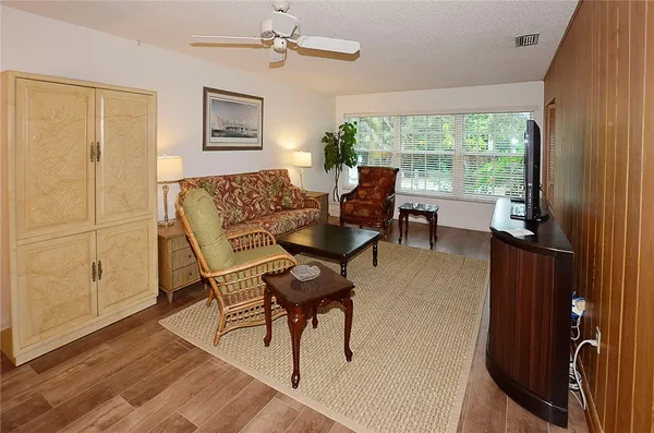 a living room with furniture and a window