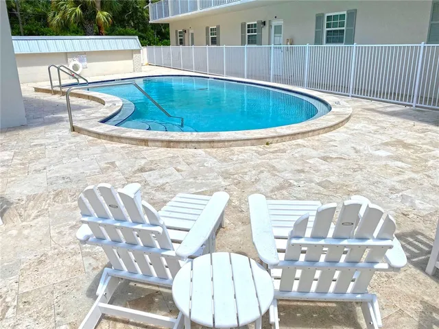 a view of a swimming pool with a patio