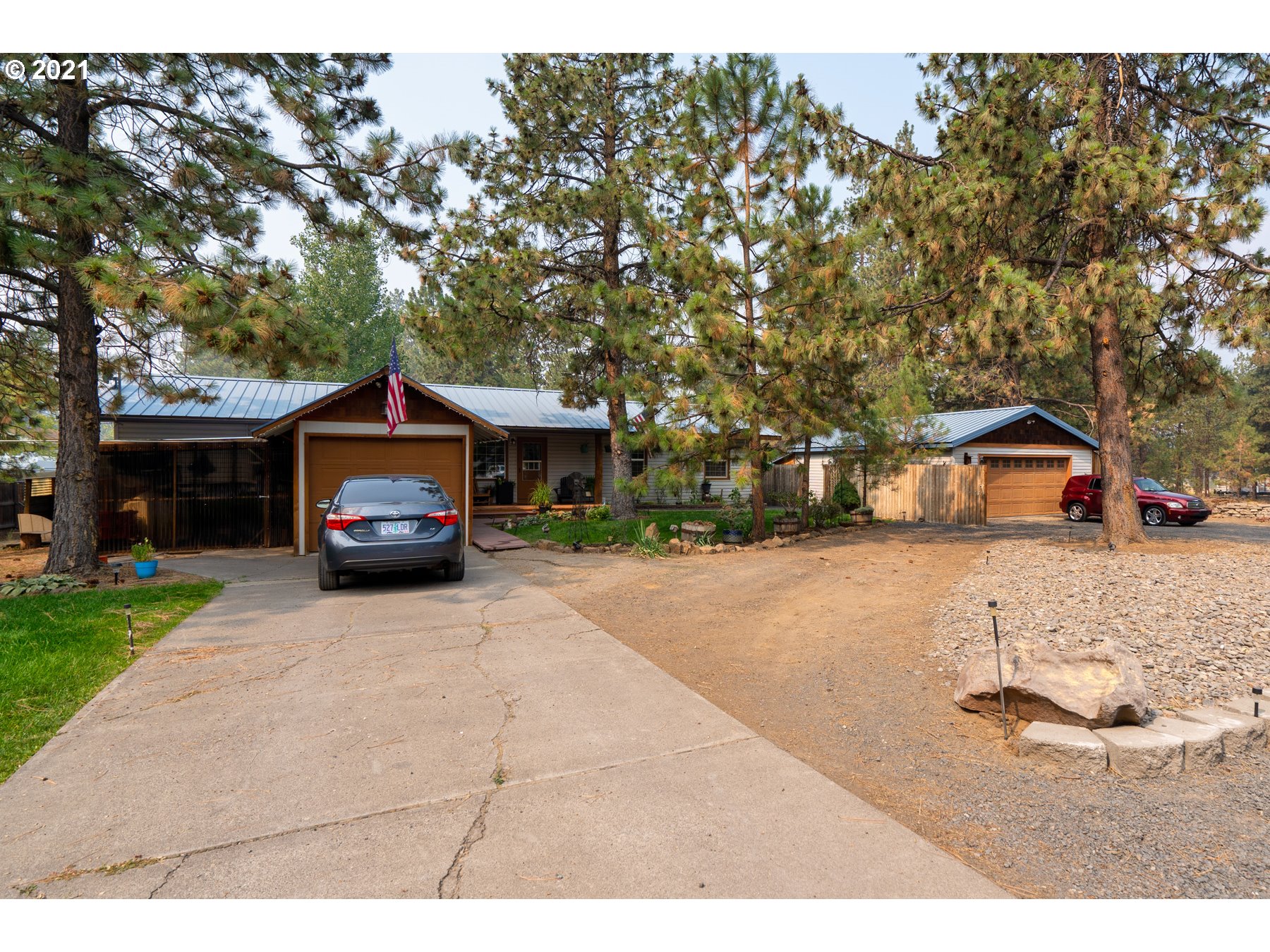 19382 Indian Summer Road Bend, OR 97702 - Photo 1 of 23 a house view with a car parked in front of it