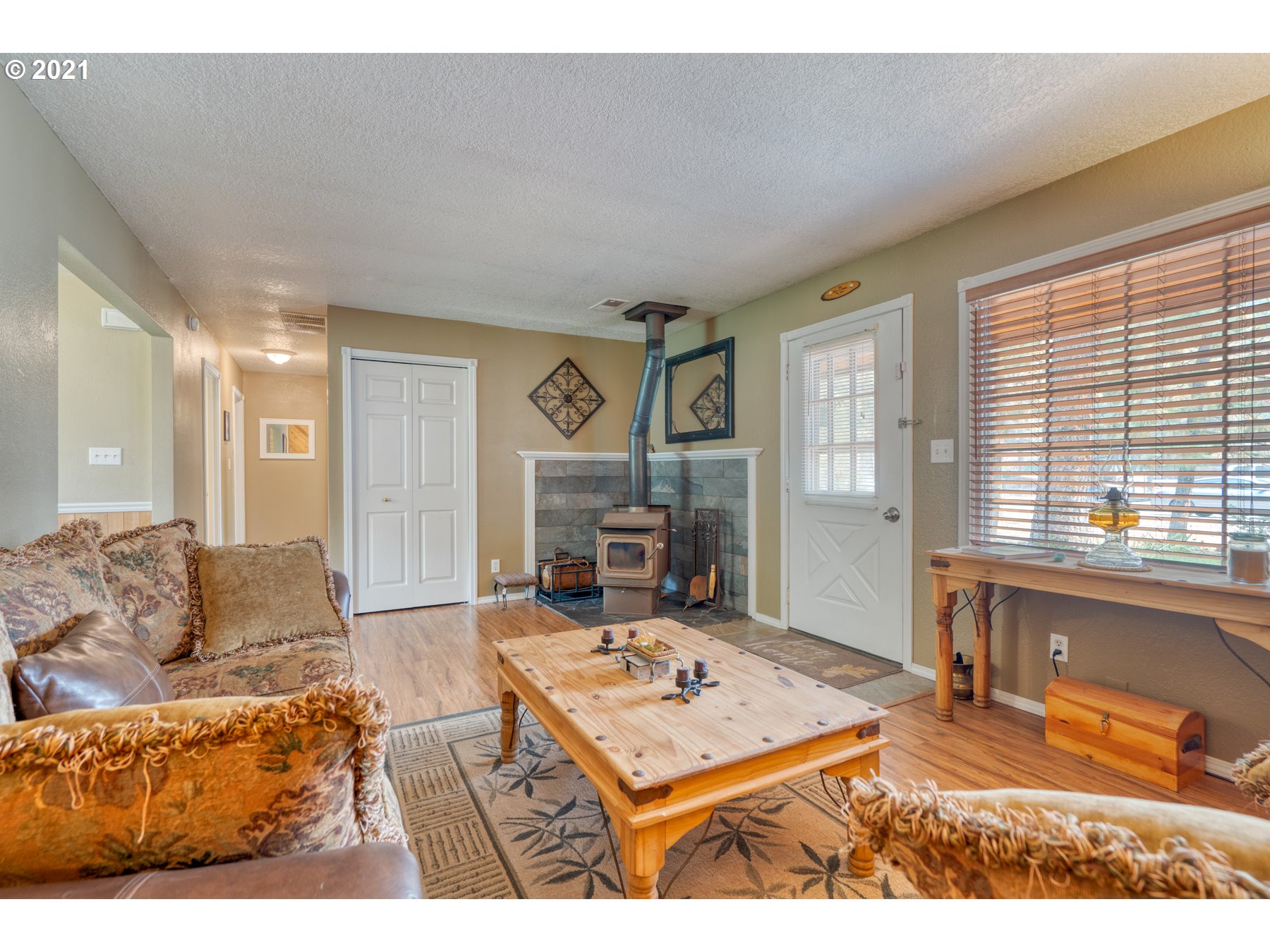 19382 Indian Summer Road Bend, OR 97702 - Photo 3 of 23 a living room with furniture and a fireplace