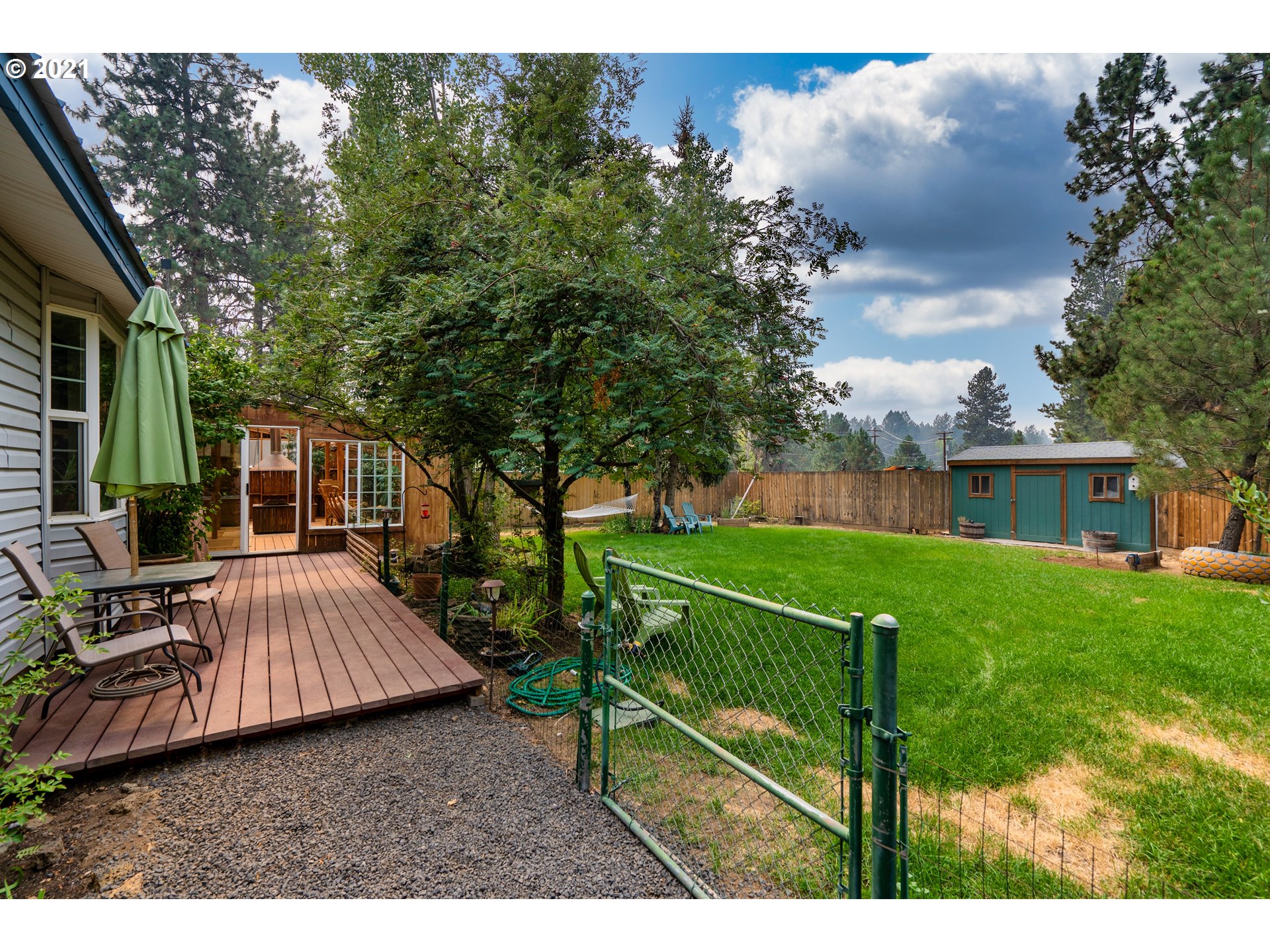 19382 Indian Summer Road Bend, OR 97702 - Photo 22 of 23 a view of backyard with deck and outdoor seating