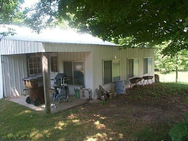 2020 North Saddler Road Luther, MI 49656 - Photo 32 of 34 Garage 3 Season Room
