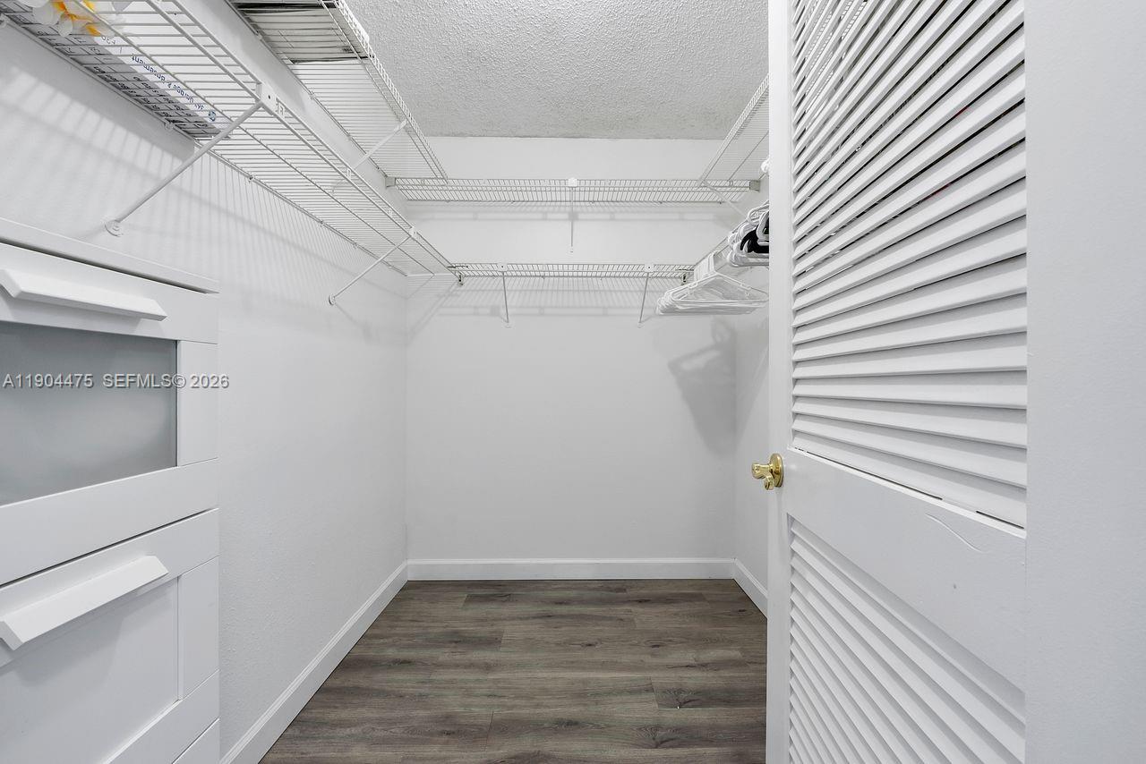 23249 Barwood Lane North, Unit 102 Boca Raton, FL 33428 - Photo 11 of 45 a view of a room with wooden floor