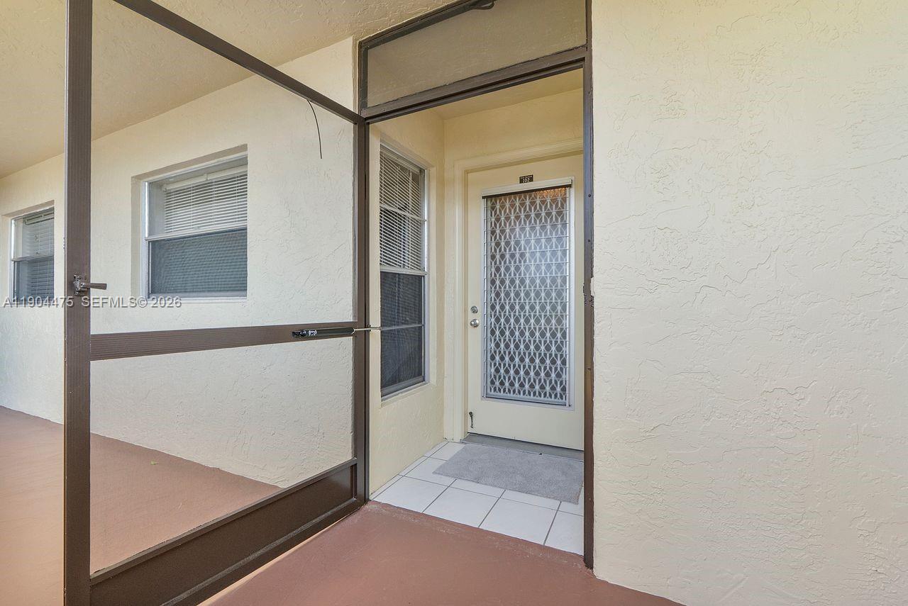23249 Barwood Lane North, Unit 102 Boca Raton, FL 33428 - Photo 12 of 45 a view of front door