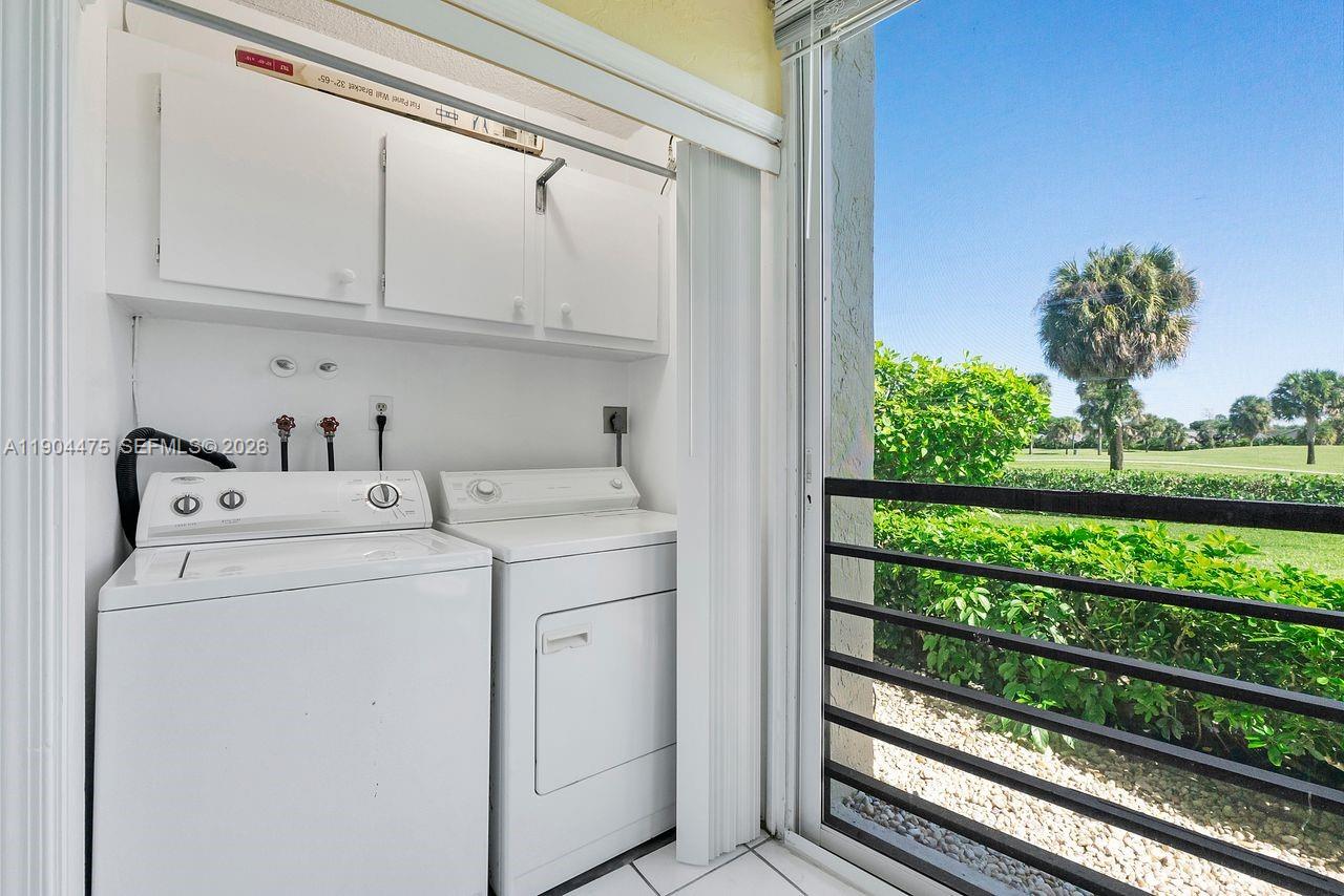 23249 Barwood Lane North, Unit 102 Boca Raton, FL 33428 - Photo 18 of 45 a utility room with dryer and washer