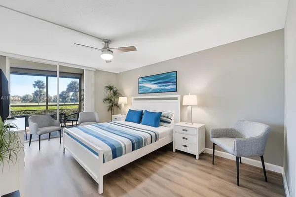 a bedroom with a bed and a table