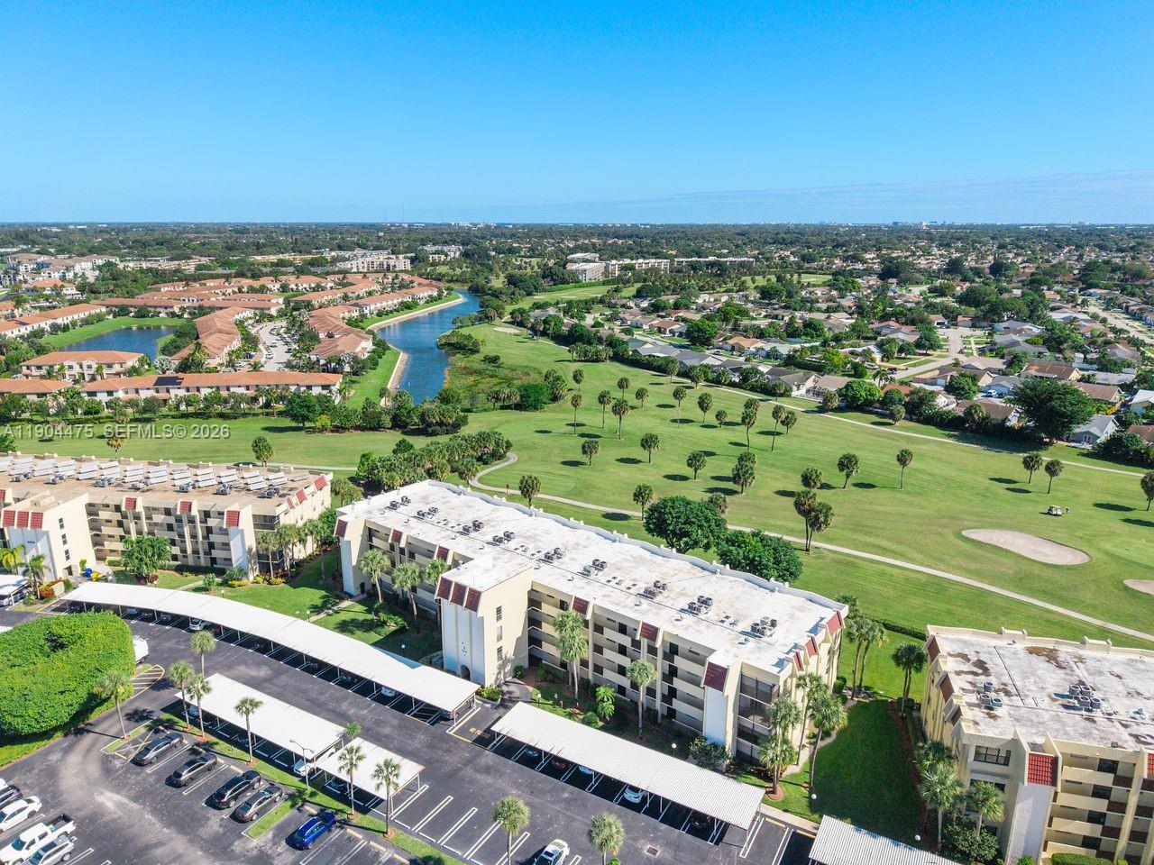 23249 Barwood Lane North, Unit 102 Boca Raton, FL 33428 - Photo 36 of 45 an aerial view of a city with lots of residential buildings