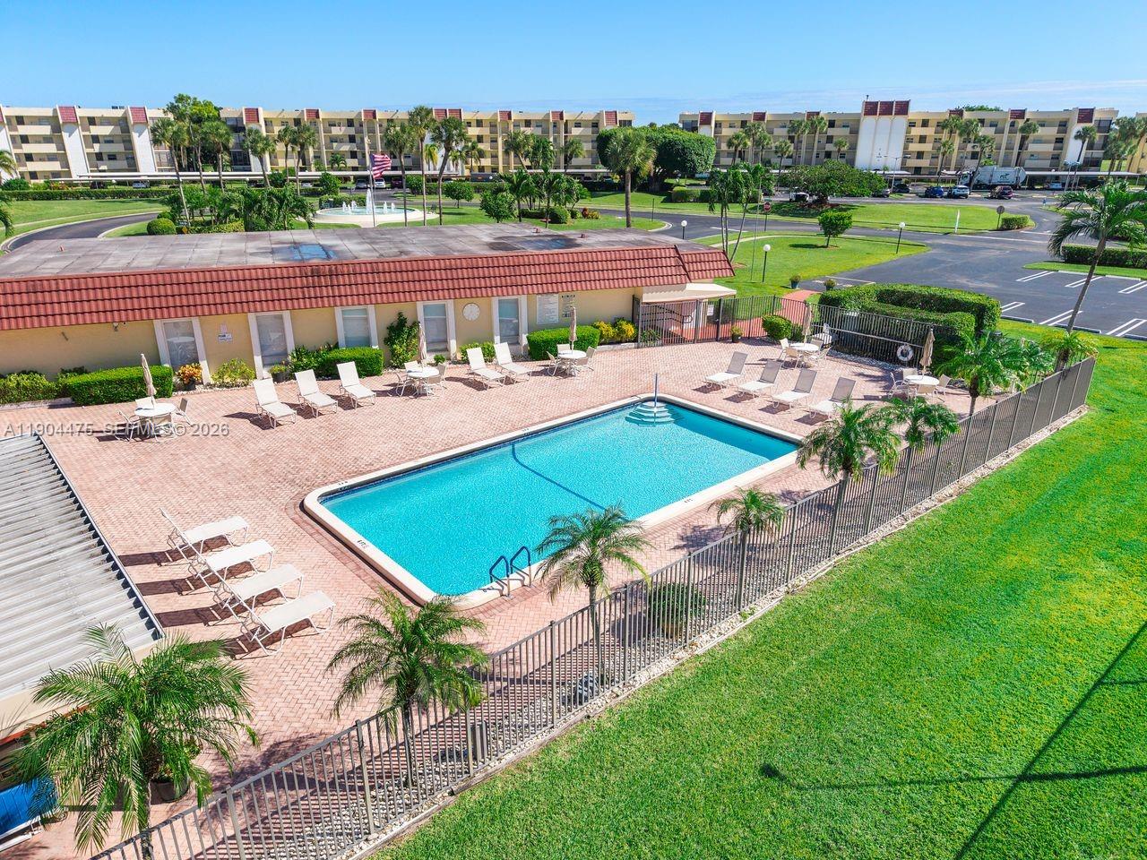 23249 Barwood Lane North, Unit 102 Boca Raton, FL 33428 - Photo 37 of 45 an outdoor space with furniture and city view
