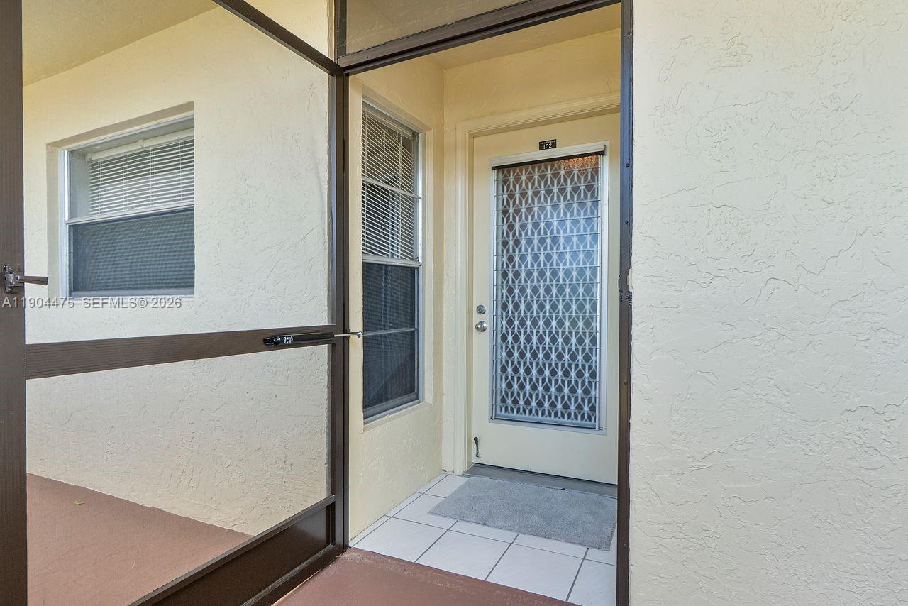 23249 Barwood Lane North, Unit 102 Boca Raton, FL 33428 - Photo 41 of 45 a view of front door