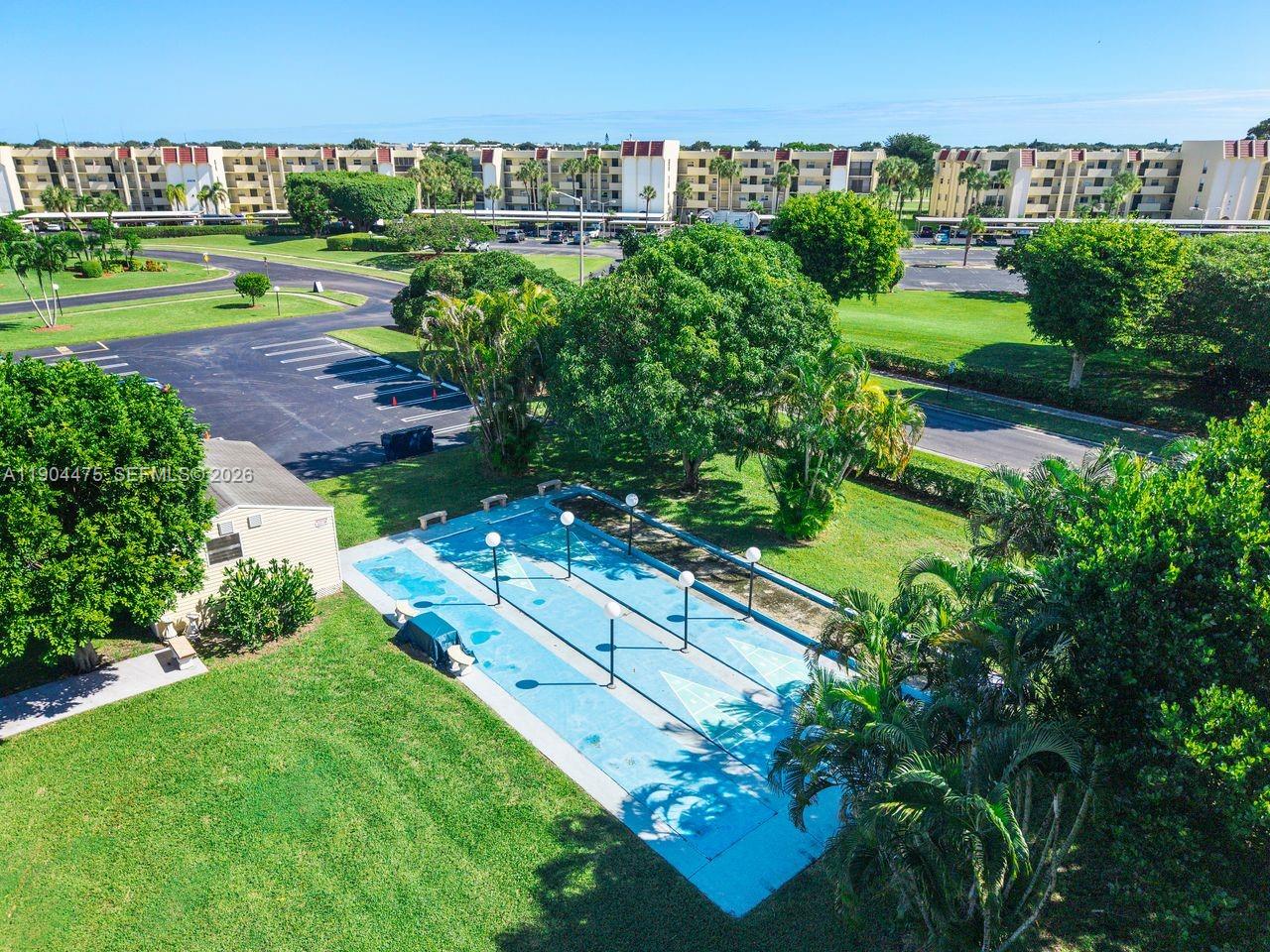 23249 Barwood Lane North, Unit 102 Boca Raton, FL 33428 - Photo 43 of 45 an aerial view of a residential houses with outdoor space and street view