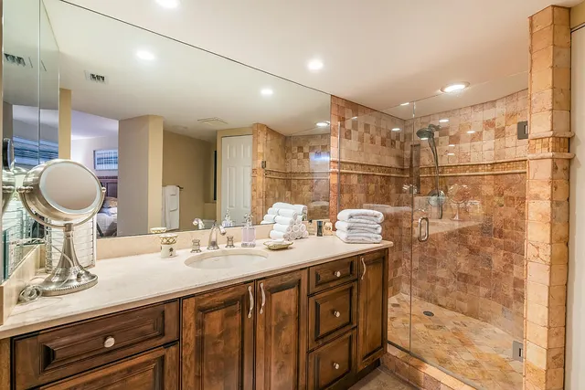 a bedroom with a large bed and a large window