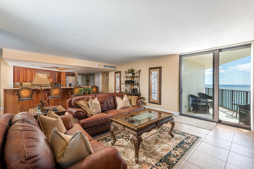 5420 North Ocean Drive, Unit 1906 Riviera Beach, FL 33404 - Photo 3 of 25 a living room with furniture and a table