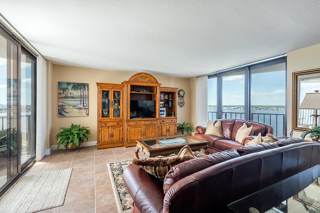 5420 North Ocean Drive, Unit 1906 Riviera Beach, FL 33404 - Photo 4 of 25 a living room with furniture and a large window