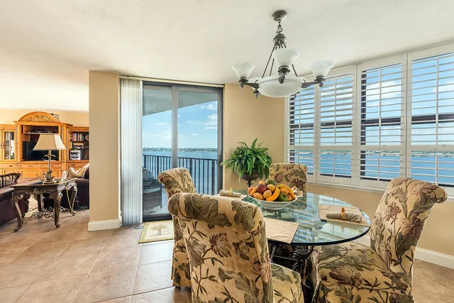 a dining room with furniture and window