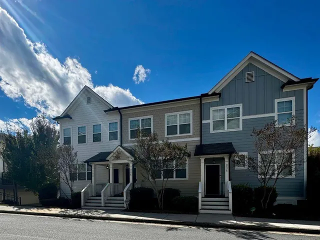 a front view of a house with yard