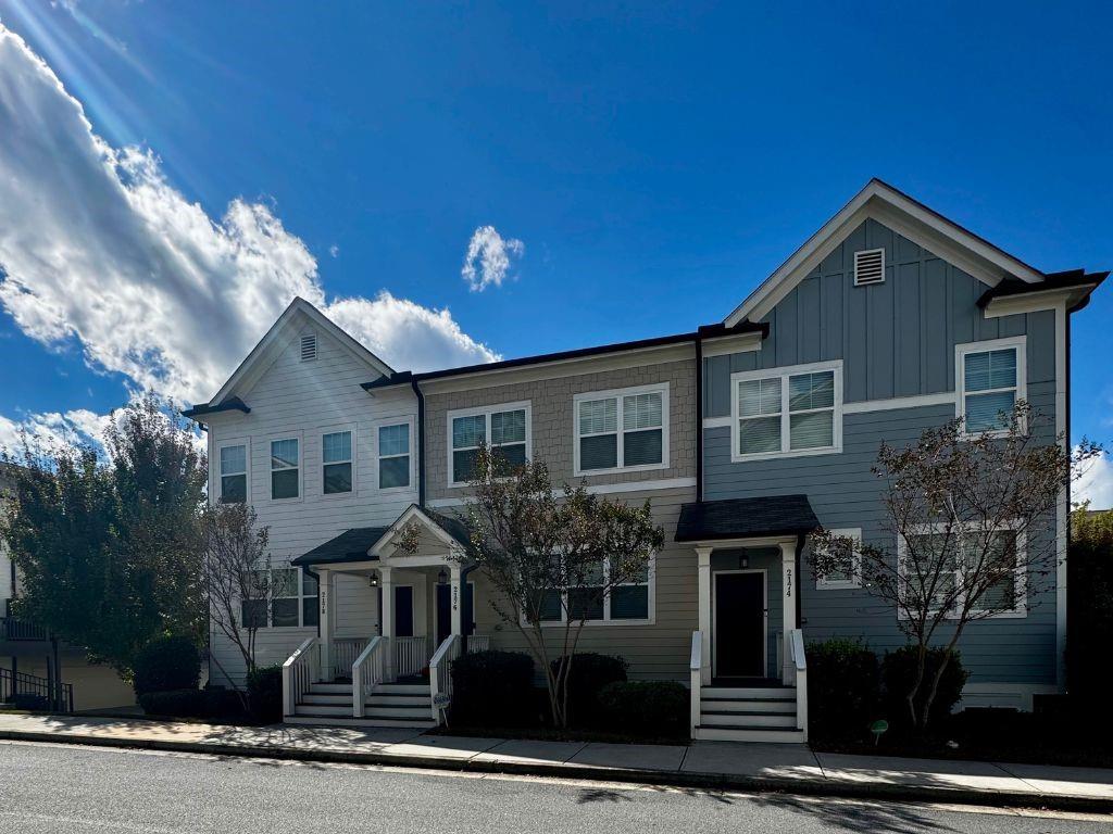 a front view of a house with yard