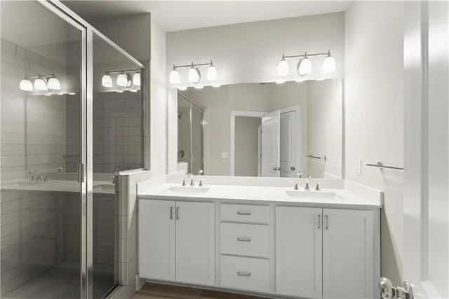a bathroom with a double vanity sink and a mirror