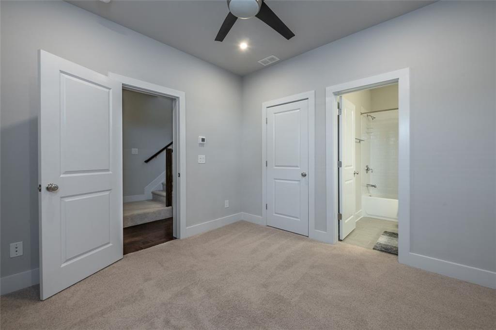2178 Wiggins Walk Atlanta, GA 30316 - Photo 17 of 31 an empty room with closet and a chandelier fan