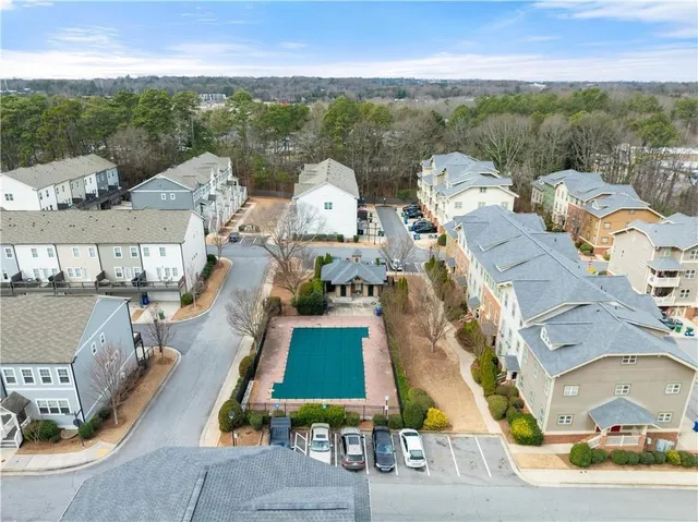 an aerial view of residential houses with outdoor space