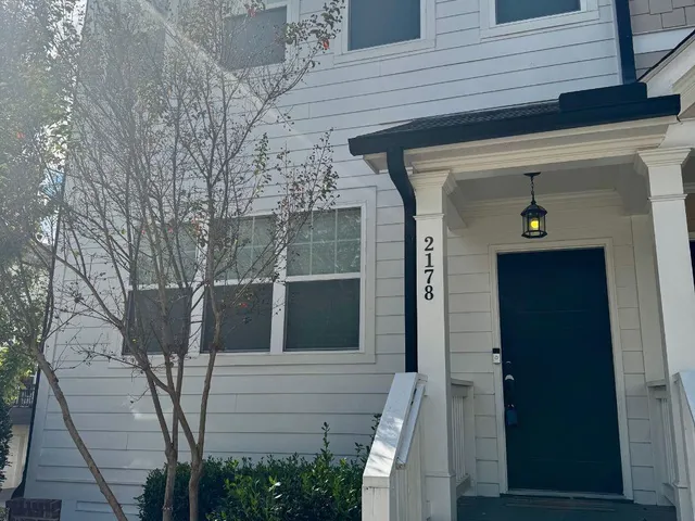 a view of a house with a tree