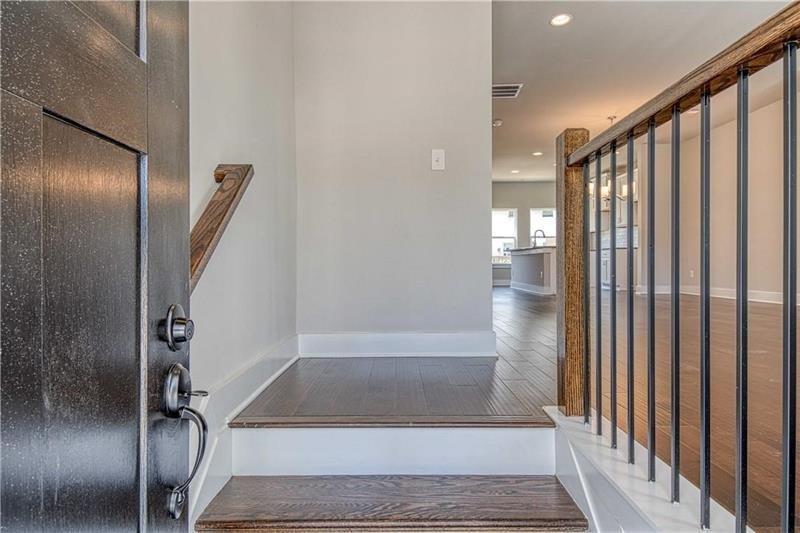 2178 Wiggins Walk Atlanta, GA 30316 - Photo 6 of 31 a view of staircase with white walls and railing