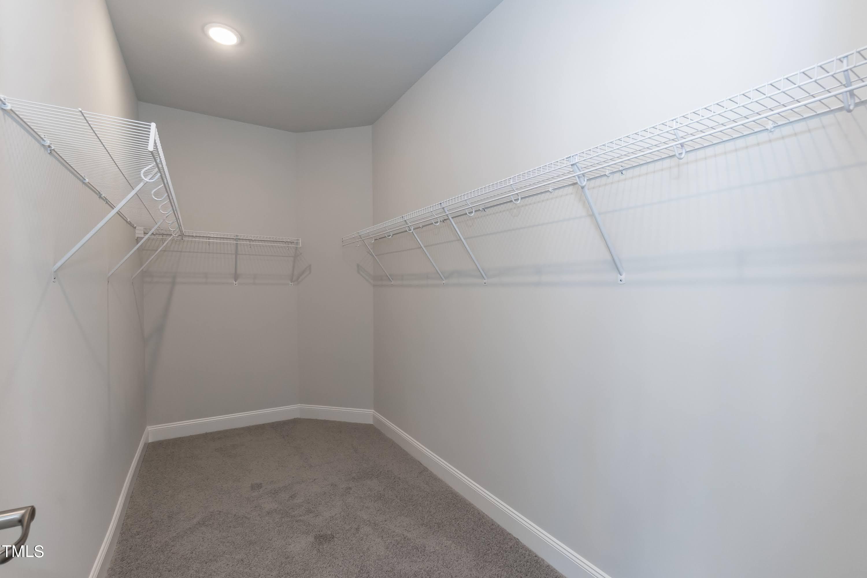 45 High Hampton Way Fuquay-Varina, NC 27526 - Photo 19 of 43 a view of a room with racks on the wall